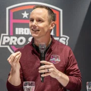 Scott DeRue speaks at an Ironman event