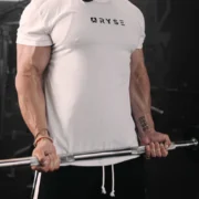 an image of a man wearing a RYSE tee and lifting weights