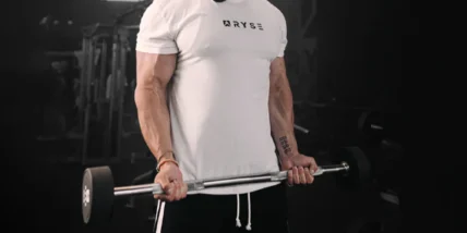 an image of a man wearing a RYSE tee and lifting weights