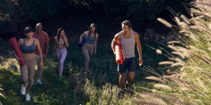 an image of people with yoga gear in the outdoors