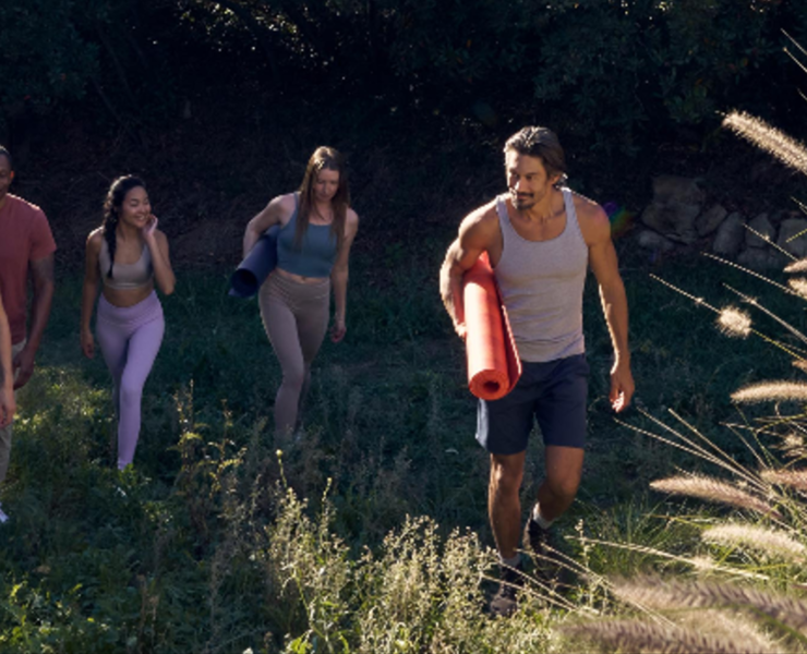 an image of people with yoga gear in the outdoors