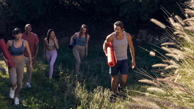 an image of people with yoga gear in the outdoors