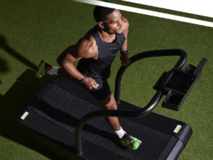 a man running on the Curve, a Woodway treadmill