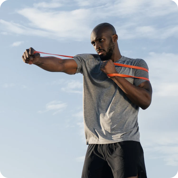 a man working out with a Straffr resistance band