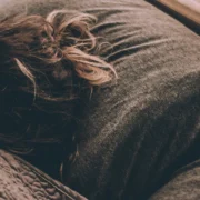 woman laying down in bed