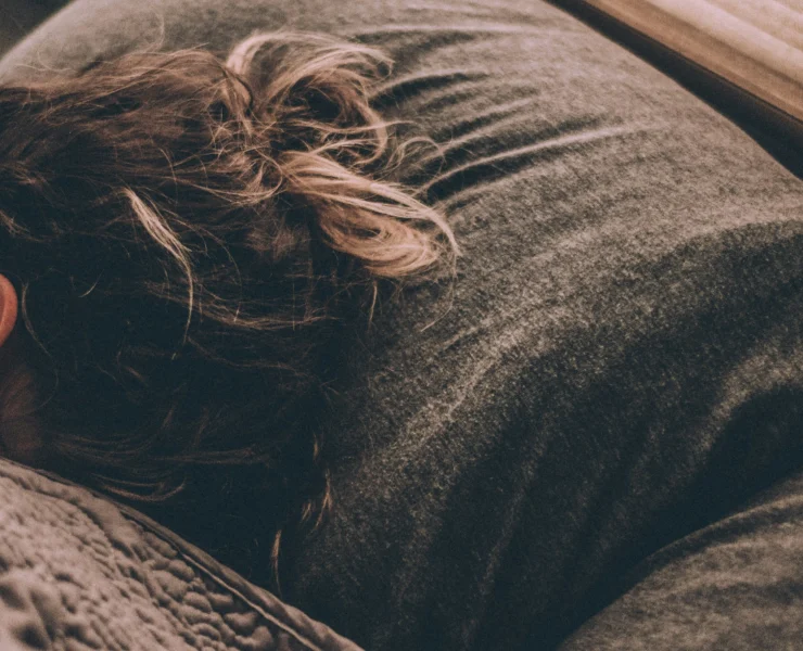 woman laying down in bed