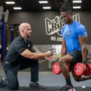 man works out at Crunch Fitness during a personal training session