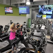 People working out lookign at screen