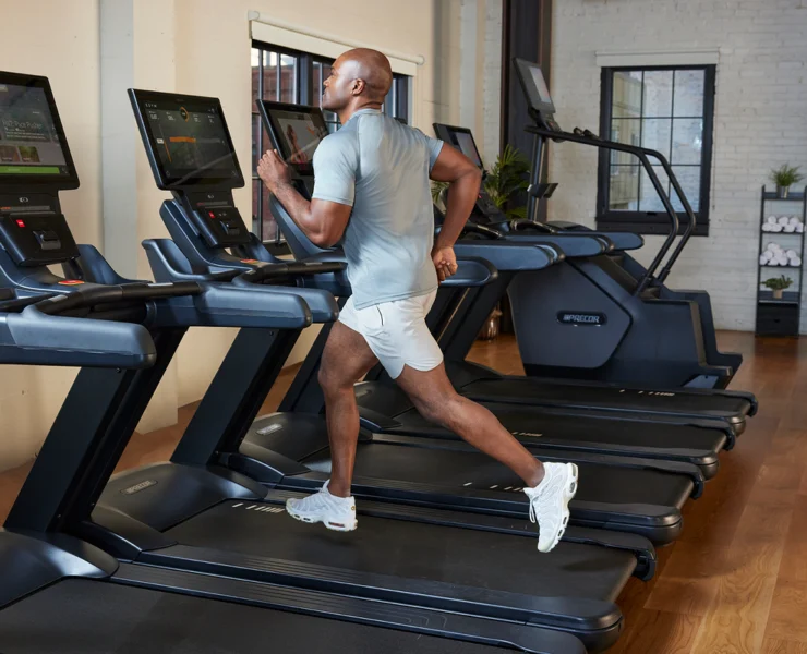 man running on treadmill