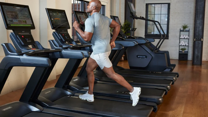 man running on treadmill