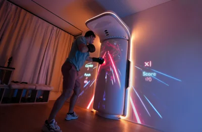 man punches a Growl boxing bag