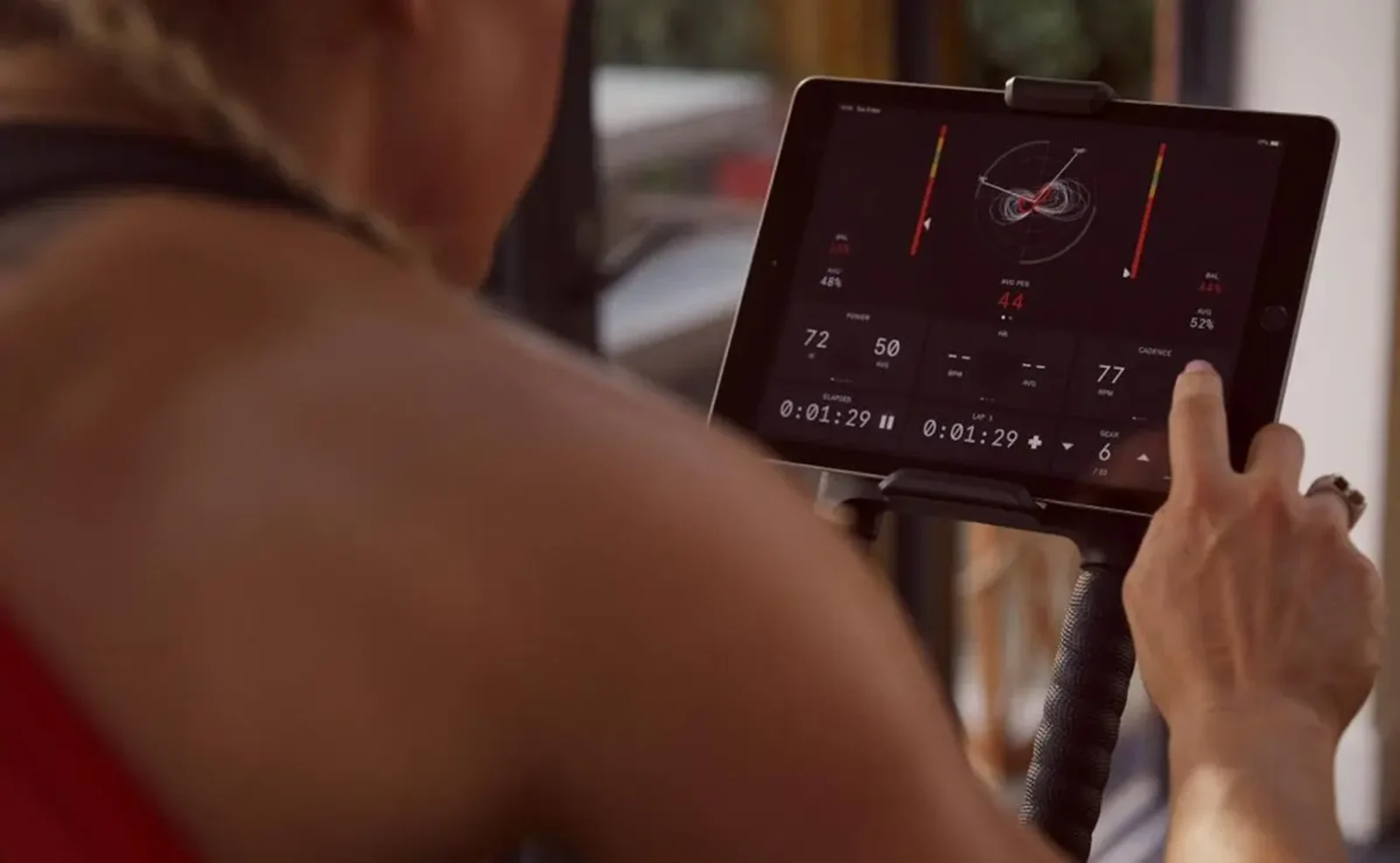 a cycling enthusiast engaging with Wattbike's Hub training app.