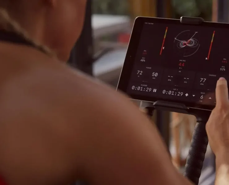 a cycling enthusiast engaging with Wattbike's Hub training app.