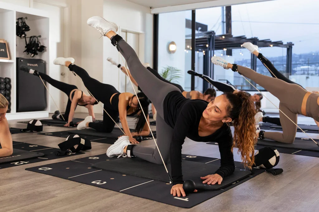 an in-studio Pvolve class with women working out