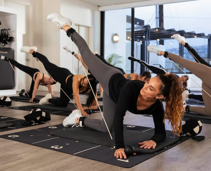 an in-studio Pvolve class with women working out