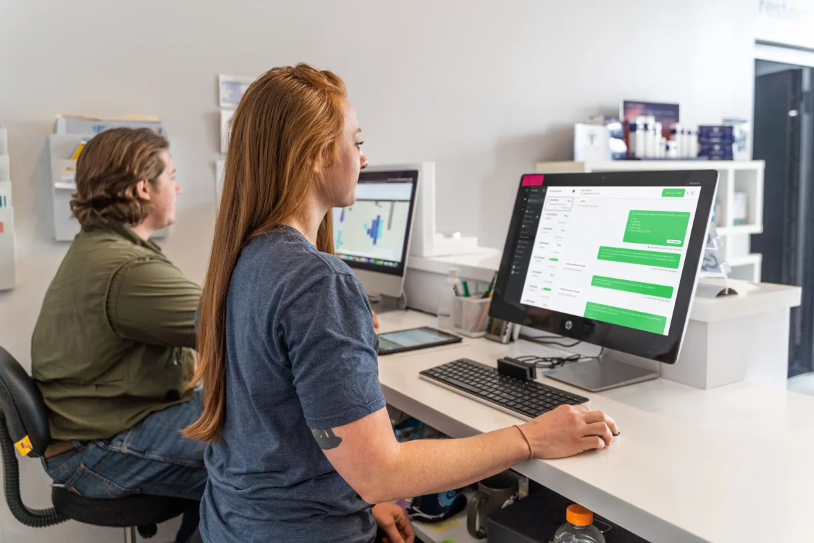 woman sitting at computer desk
