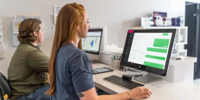 woman sitting at computer desk