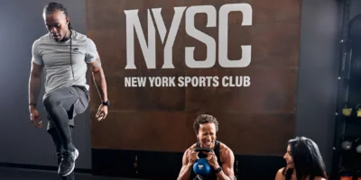 three people working out at NYSC with Les Mills new boutique fitness programs