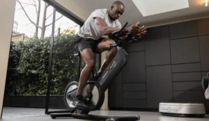 Black man on Power Plate Rev bike