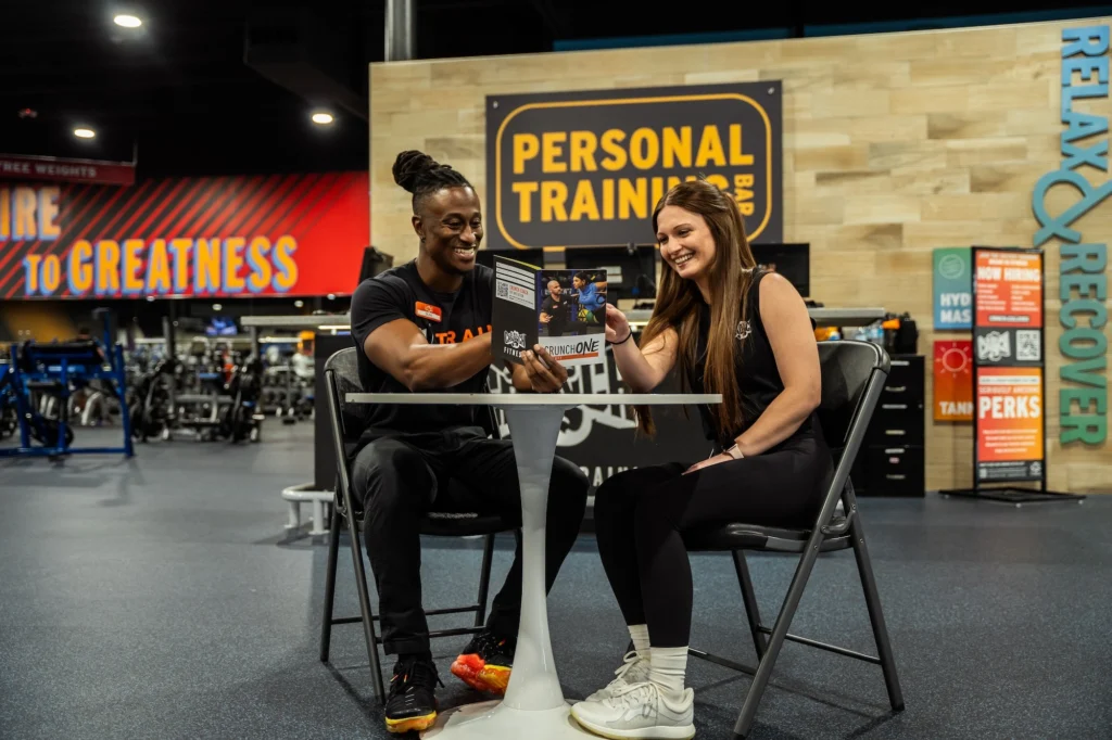 woman meets for a personal training consultation at Crunch Fitness