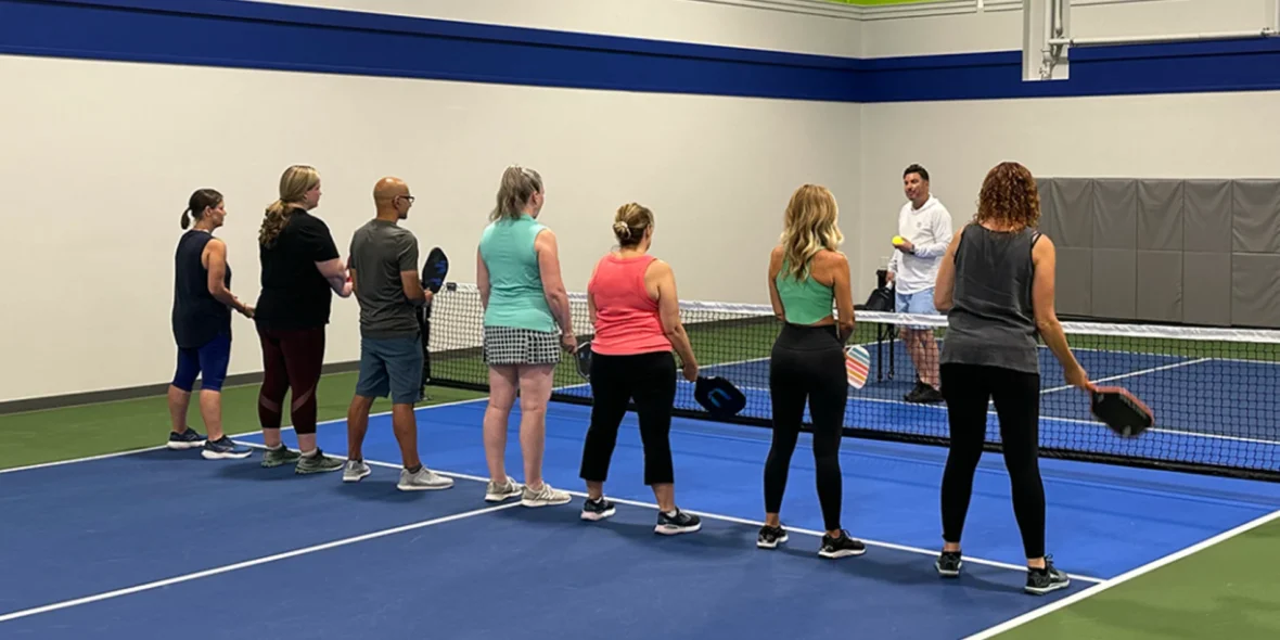 a group of people at PickleRage's pickleball clinic