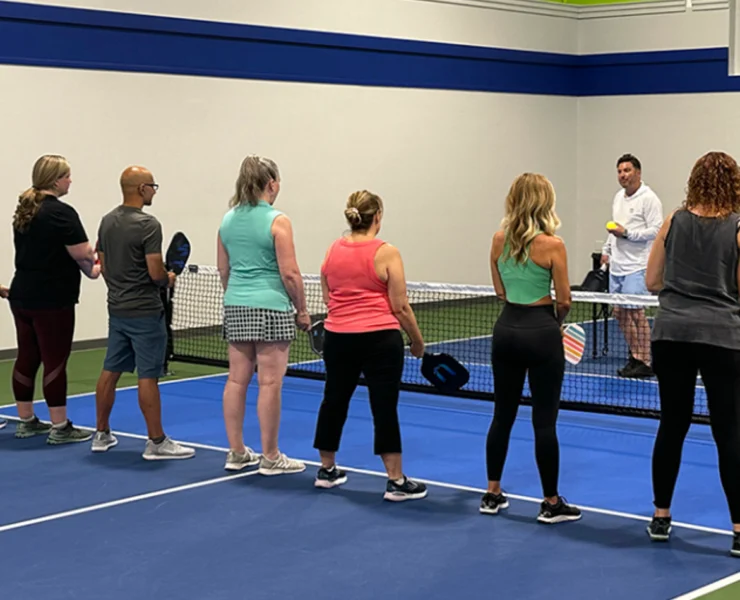 a group of people at PickleRage's pickleball clinic