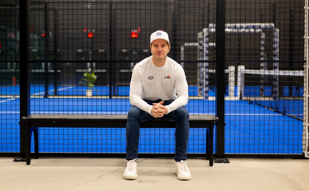 Padel Haus CEO Santiago Gomez poses in front of a padel court