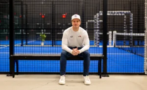 Padel Haus CEO Santiago Gomez poses in front of a padel court