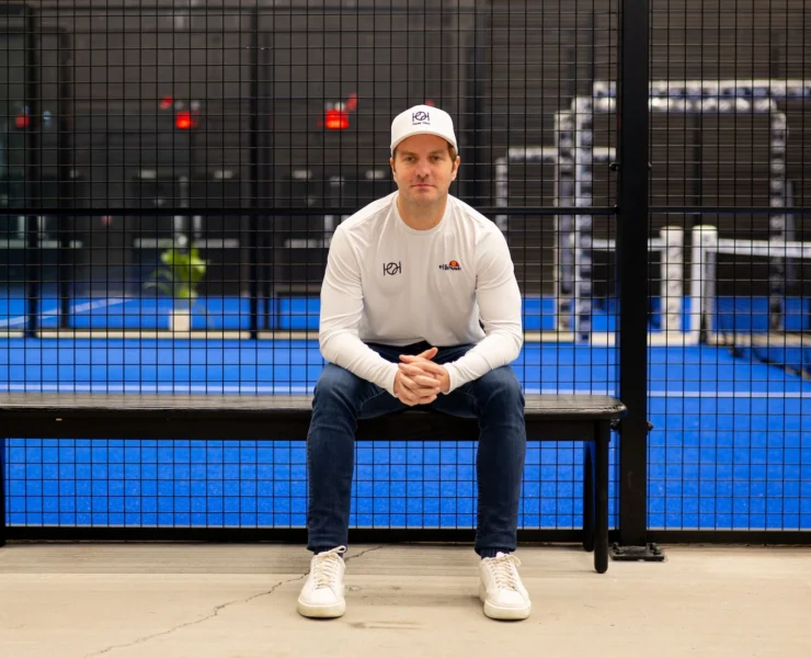 Padel Haus CEO Santiago Gomez poses in front of a padel court