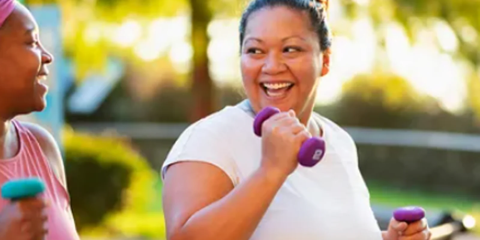 an image of two woman working out together outdoors