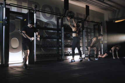 people strength training at gym
