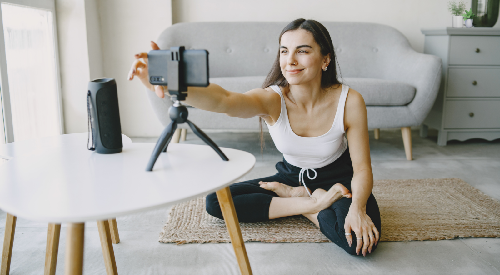 Woman filming self for fitness video