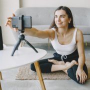 Woman filming self for fitness video