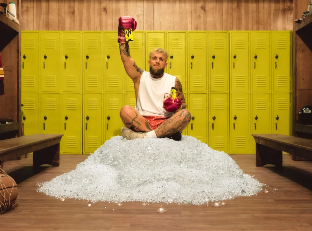 Jake Paul poses with W men's care products