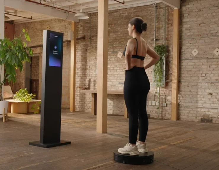 Woman using body scanning equipment