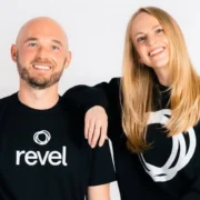 a smiling headshot of Revel owners