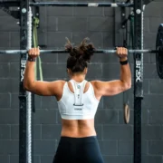 woman performs an overhead press