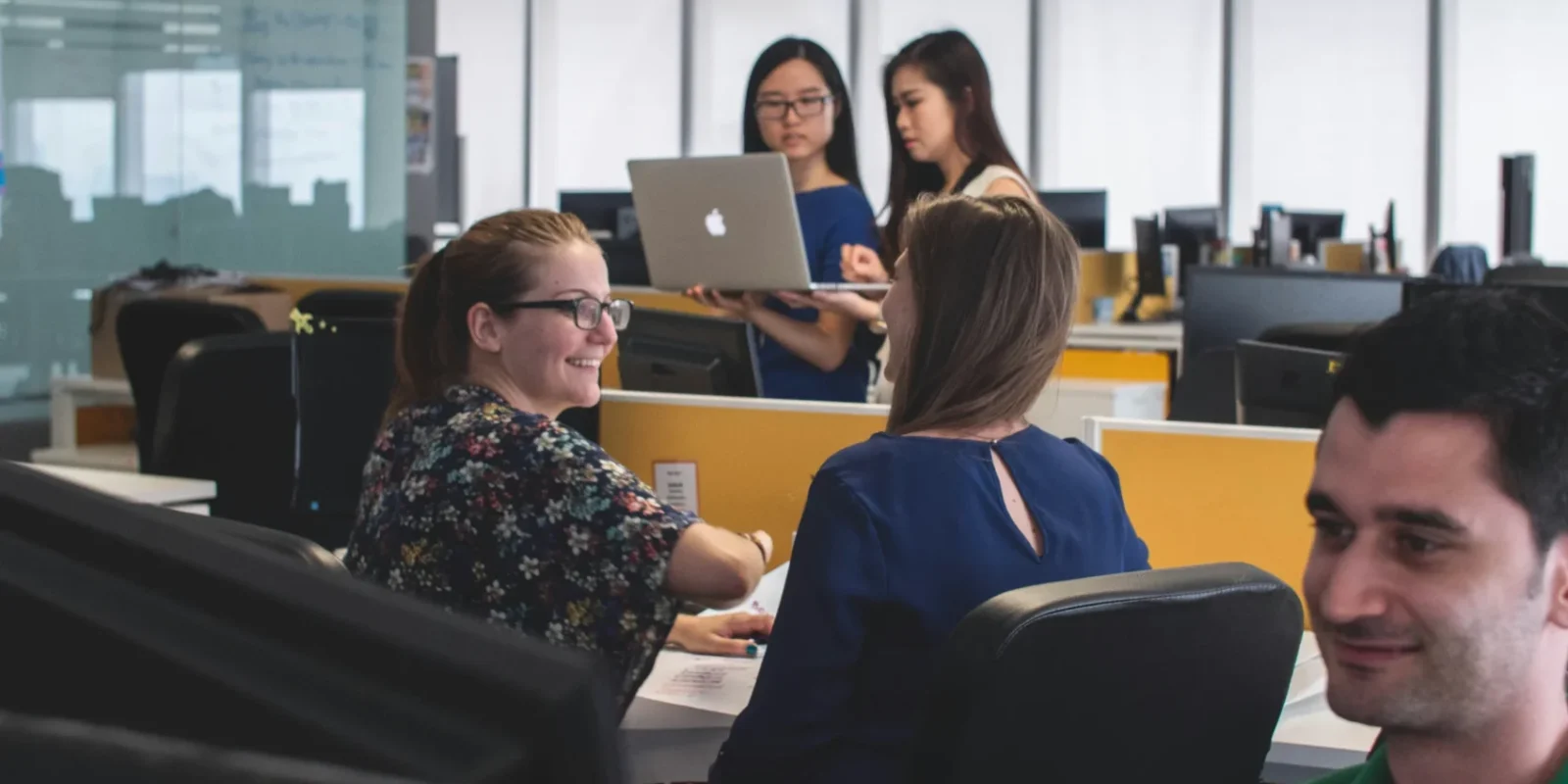 happy people in an office / employee wellness