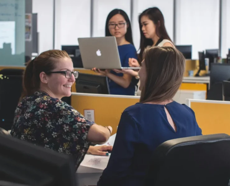 happy people in an office / employee wellness