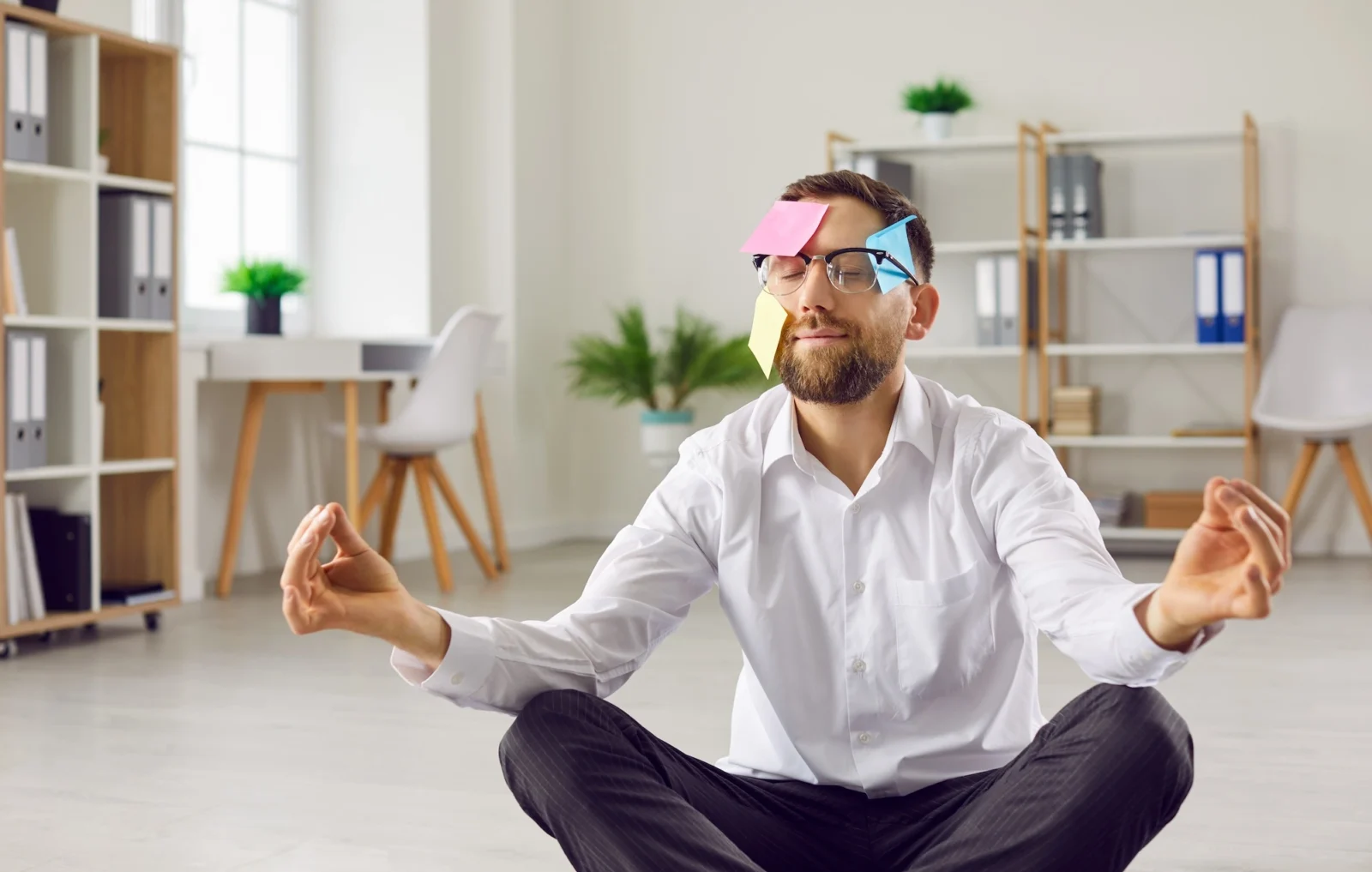 man meditates during a workplace wellness seminar