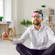 man meditates during a workplace wellness seminar