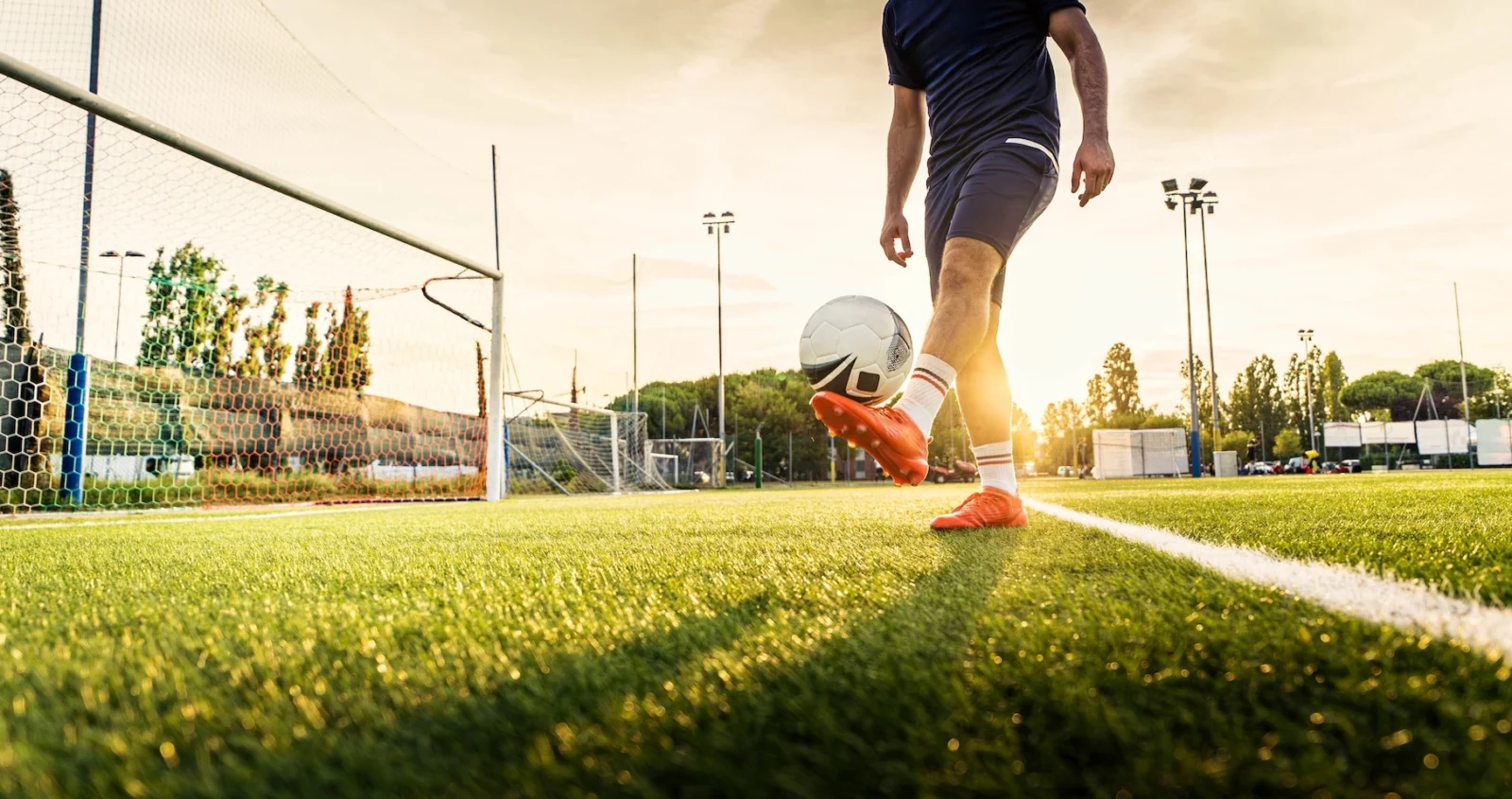 man juggles a soccer ball