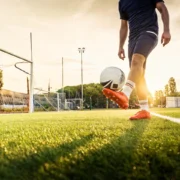 man juggles a soccer ball