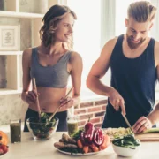 man and woman prepapre healthy food in the kitchen