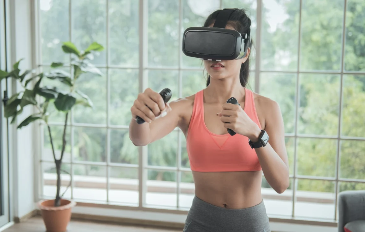 woman works out wearing a virtual reality headband