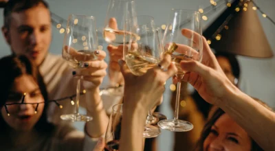 people celebrating with wine