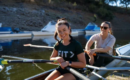 woman rows wearing an iFIT shirt
