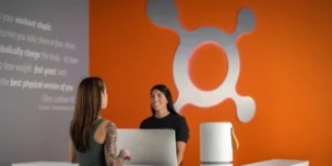 the front desk at Orangetheory with an air purifier from Molekule