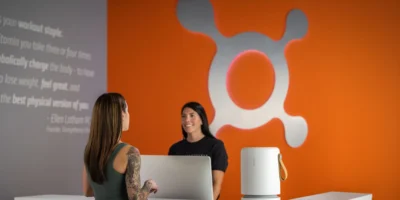 the front desk at Orangetheory with an air purifier from Molekule