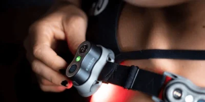 Kineon recovery tech being used on the shoulder of a female